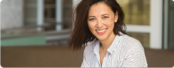 woman smiling with tagline 'Poise pads, for women who need a little extra protection', and a 'learn more' button